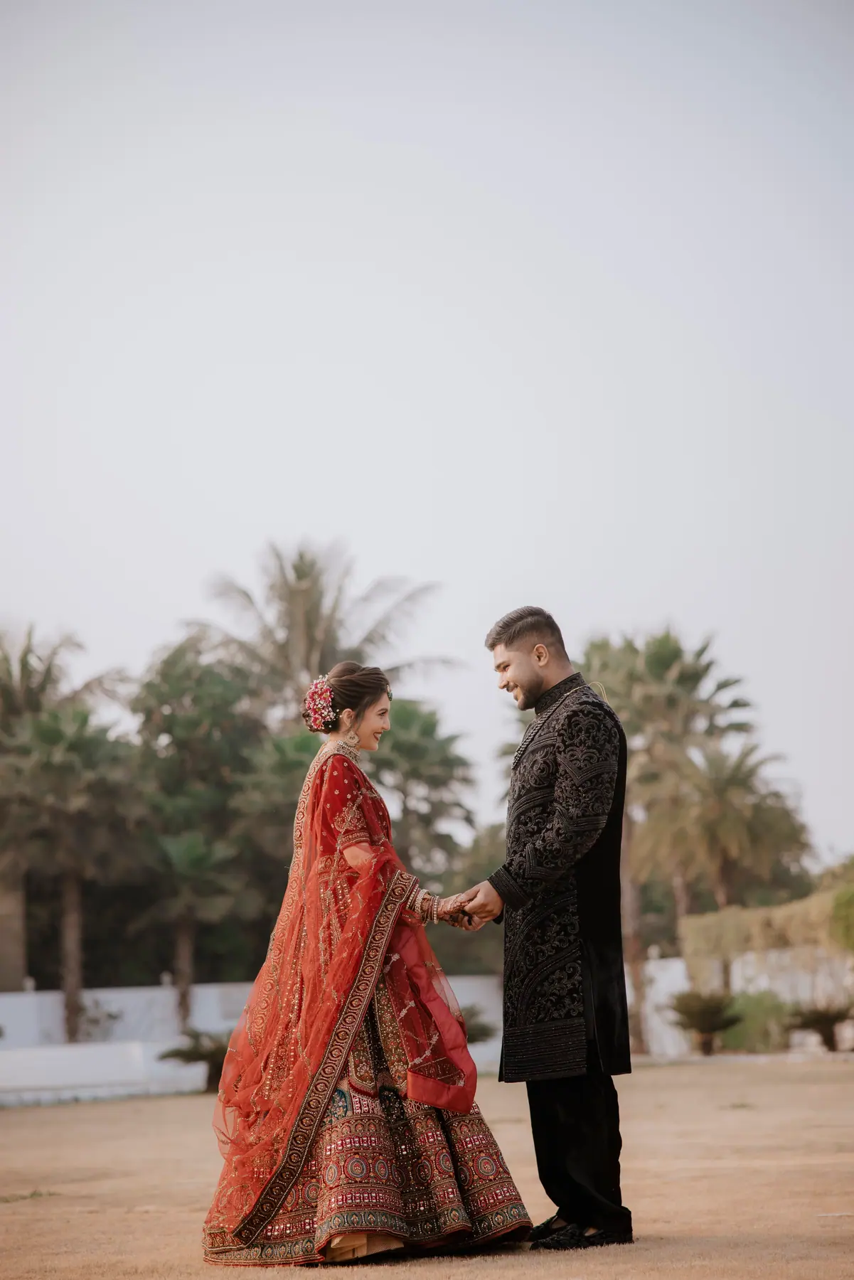 Aamir & Binish walking together in a quiet wedding portrait